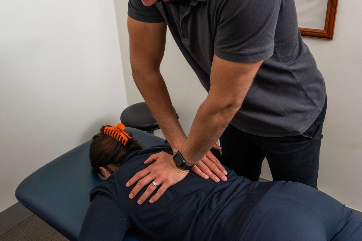 Dr Bader performing a spinal adjustment
